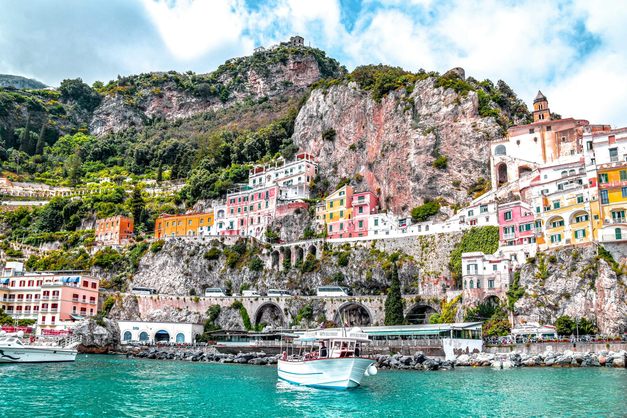 Sail past the Amalfi coast where brightly-coloured houses cling to the coastline