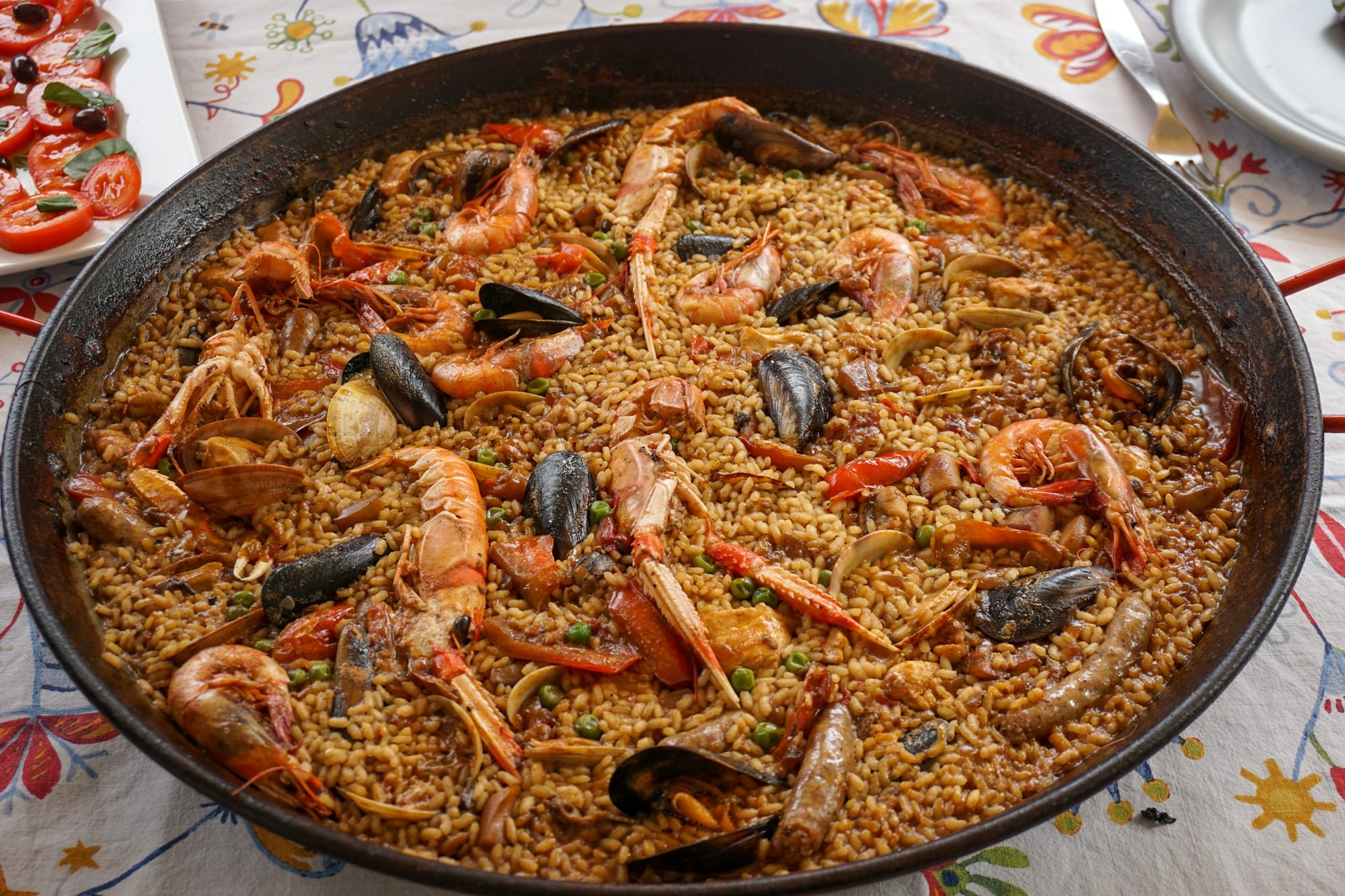 Devour paella where it originated, beginning as 'Valencian rice'