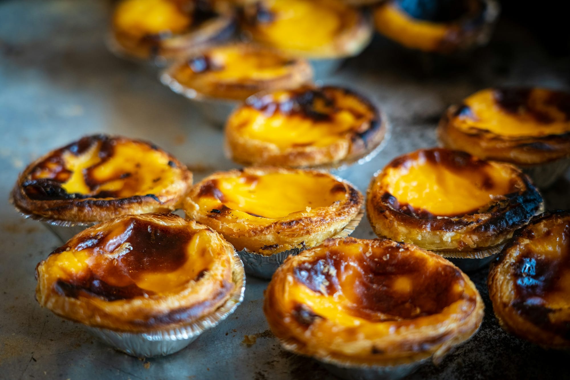 Enjoy pastéis de nata in Lisbon where they were first baked in the eighteenth century
